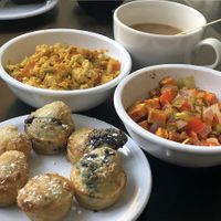 Cheesy JustEgg scramble (top), sweet potato home fries, and pancake bites (bottom). at 4th & State in Columbus