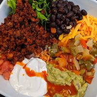 burrito bowl with some hot sauce at 4th & State in Columbus