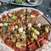 Vegan böregi (almost finished) in the back. Very good! Vegan pizza in the front, also real good    at Keyif in Goreme