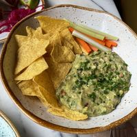 Los nachos estaban muy ricos, aunque para mi demasiado cilantro at Basilio in Lisbon