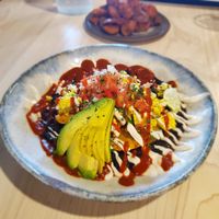 Ranchero 

Vegan black beans 
Cashew Crems
Ranchero Sauce
Pico
Avocado 
Tofu at Bearcat Cafe - CBD in New Orleans