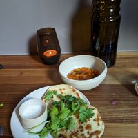 naan with yoghurt sauce, beans at Leuchtendroter in Frankfurt