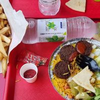 Falafels were pretty good, but it's a pretty dry plate without the white sauce. Fries were a very big portion for the price, definitely enough to split between two people. at The Halal Guys in Seoul