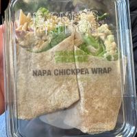 Napa Chickpea Wrap. Looks a bit sad, tasted okay. Container is sealed well    at ORD - Farmers Fridge - T3 in Chicago