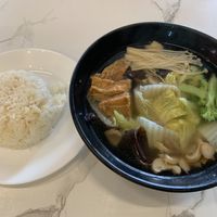 Clear veggie soup with ricee  at Botanict 豐之素 in West Singapore