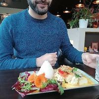 My friend getting ready for his curry at KIM999 in Berlin