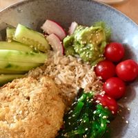 Vegan poke: falafel with white beans, basmati rice, chukka, radish, cucumber, cherry tomatoes, guacamole (avocado with spices), lemon, sesame seeds at Sova in Tula