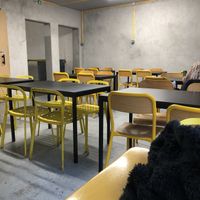 Simple functional upstairs seating  at Furahaa - Vegan in Paris