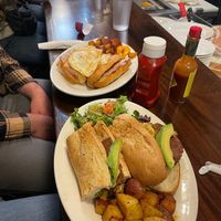Vegan food in the front- just egg, plant sausage, potatoes, and salad  at Bonjour Cafe in Boston