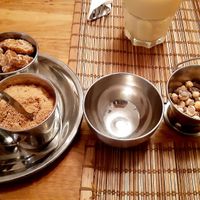 Indian sugar that goes with the tea, offered dried chickpeas as a starter at Indian Food in Villeneuve