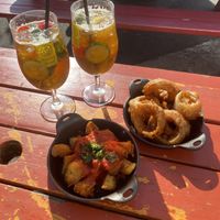 Onion rings and patatas bravas and Pimms   at Brewhouse and Kitchen in Bristol
