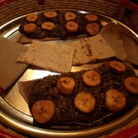 Afrika plate (twice): spinach-peanut sauce and cooked banana, served with bread at Afrika in Mannheim