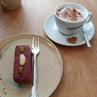 Raspberry cake and cappuccino at Alge in Villach
