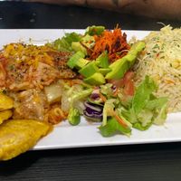 Eggplant lasagna with rice pilaf salad and tostones at Antojitos Veganos in Bayamon