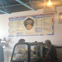 Jacob serving customer  at Waffle Monkey in George Town