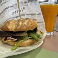 Chicken burger and orange juice  at Moko Veggie Café - Alvalade in Lisbon