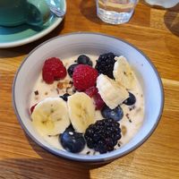 Granola and fruits with almond milk (oat milk also an option) at Zia in Paris