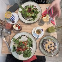 Espresso, green juice, açai and chai bowls, blueberry and peanut butter pancakes, I had the burrata toast without the burrata, my friend had a non vegan toast and a coffee.  at Healthy Lounge in Antibes