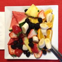 Over the top fruits and veggies on top of your main choice at Karine's in Toronto