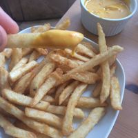 Amazing fries, not like your normal French fries with addictive cheese  at Alice & Friends' Vegan Kitchen in Chicago