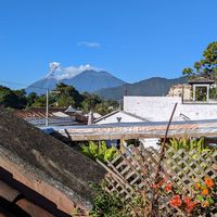 View of Fuego volcano erupting from the terrace!!! at Cafe Bohème   in Antigua