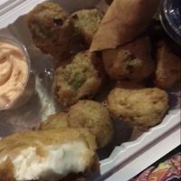 Tempura brussel sprouts, half of a spring roll, tempura cheesecake  at V.L.C Vegan Eatery in Orlando