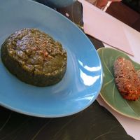 Trinxat de col y kale y croquetones de calabacín y queso vegano at Raco de Les Fades in Alp