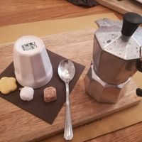 Coffee in Moka with Vegan Biscuit and Sugar at Sfoglia Rina in Bologna