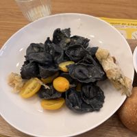 vegan option changes weekly! Black tortellini with potatoes & leek in ginger oil. Not super flavourful despite the strong ingredients   at Sfoglia Rina in Bologna