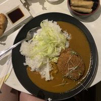 Pumpkin curry with yubamaki and spring rolls at Pompoko in Brighton