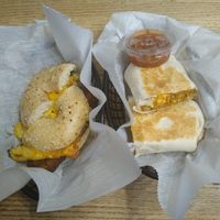 Breakfast sandwich with bacon and chorizo tofu scramble breakfast burritto. at Square One Cafe in Schenectady