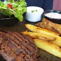Mushroom steaks and potato wedges at Downtown - Vegan Garden Restaurant in Chiang Mai