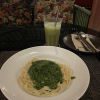 Pesto pasta and matcha lattee  at Downtown - Vegan Garden Restaurant in Chiang Mai