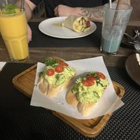Garlic bread avo, power wrap (1/2 of it left, in the back), mango smoothie, spirulina smoothie  at Downtown - Vegan Garden Restaurant in Chiang Mai