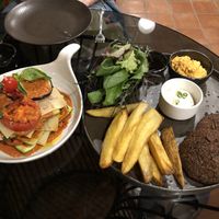 Lasagna (left, cooked version) and pesto kale steaks at Downtown - Vegan Garden Restaurant in Chiang Mai