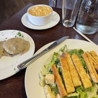 Vegan Caesar with tempeh, biscuits with sausage gravy, and Mac n “tease”. All vegan! at The Chicago Diner - Lakeview in Chicago