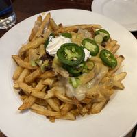 Poutine with jalapeños, bacon and sour cream (all vegan) at The Chicago Diner - Lakeview in Chicago