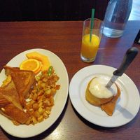 Monte cristo & cinnamon roll with orange juice. at The Chicago Diner - Lakeview in Chicago