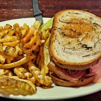 Radical Reuben with Waffle Fries  - and a pickle!😋 at The Chicago Diner - Lakeview in Chicago