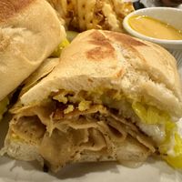 Cuban sandwich with a side of waffle fries and vegan cheddar cheese for dipping!  at The Chicago Diner - Lakeview in Chicago