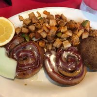 Cinnamon rolls with strawberry jam, breakfast potatoes, and seitan sausage patties  at The Chicago Diner - Lakeview in Chicago