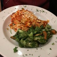 Lasagna with some sort of pesto veggie side at The Chicago Diner - Lakeview in Chicago