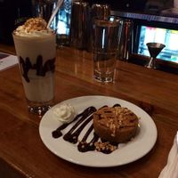peanut butter 'puck' with chocolate sauce and whipped cream & peanut butter chocolate chip milkshake at The Chicago Diner - Lakeview in Chicago