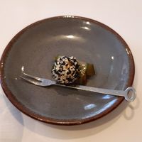 Melon dipped in seeds on a cucumber slice at 1910  in Eindhoven