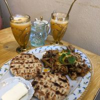 Tofu scramble with mushrooms and fresh orange juice at Bizou Cafe in Corfu