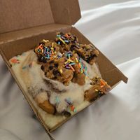 Cinnamon roll with cookie dough and sprinkles at Cinnaholic in Naperville
