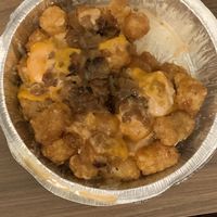 California tater tots with thousand island dressing, vegan cheese, and grilled onions at Cheesewalla in Redlands