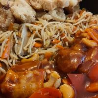 Rice noodles, salt and pepper calamari & sweet and sour chicken at Root Vegetarian in Cairns