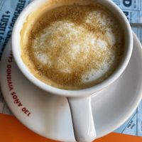 Cafe con leche with oat milk   at La Libre in Madrid