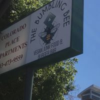 Sign out front at Bumbling Bee Vegan Junk Food in Boulder